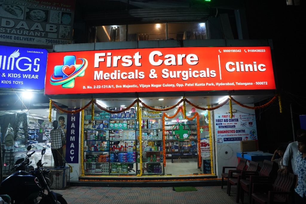 First Care Medicals & Surgicals Clinic illuminated storefront in Kukatpally, Hyderabad